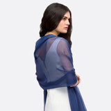 Woman wearing blue chiffon shawl with semi-opaque sheer sleeves