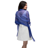 Woman wearing a blue chiffon shawl.