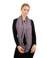 Woman wearing a purple pleated ribbed snood scarf in product ’Warm Circle Loop Tube Scarf’