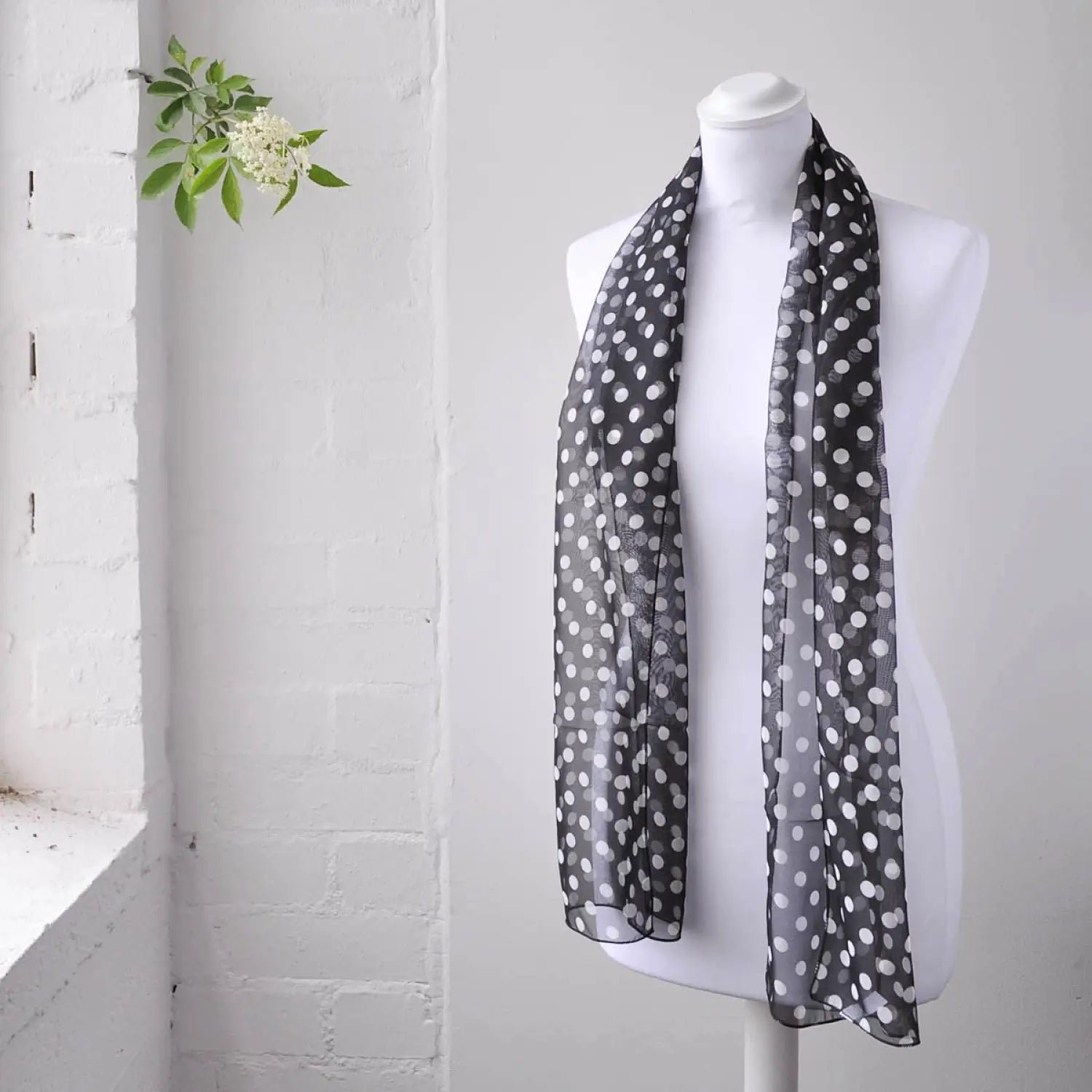 Black and white polka dot chiffon scarf on mannequin - Polka Dot Chiffon Scarf: Classic 50s & 60s Style