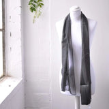 Polka dot satin scarf on mannequin.