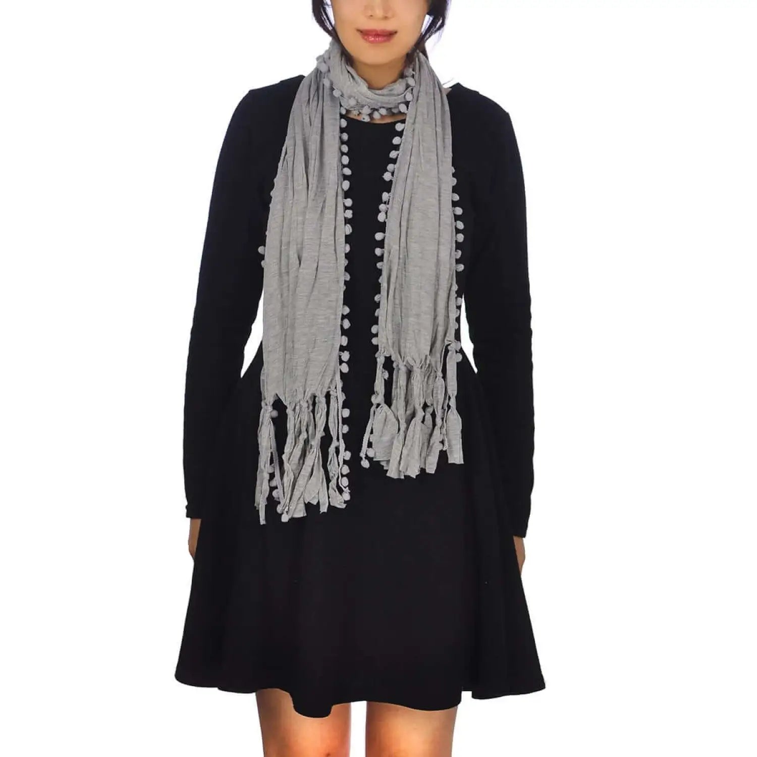 Woman in black dress and gray scarf featuring Pom Pom Edge Crinkled Fabric Long Neck Scarf