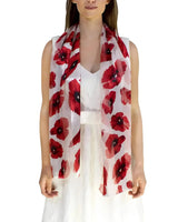 Woman wearing white dress with red poppy floral print scarf in Poppy Floral Print Scarf & Gold Plated Ring Set.
