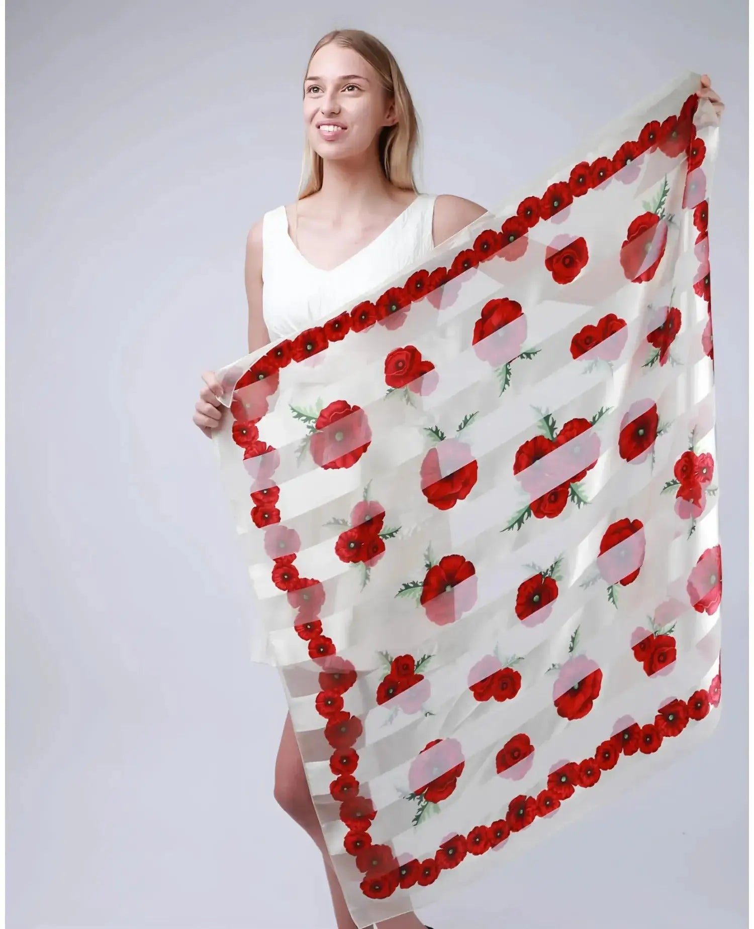 Large square poppy scarf held by woman