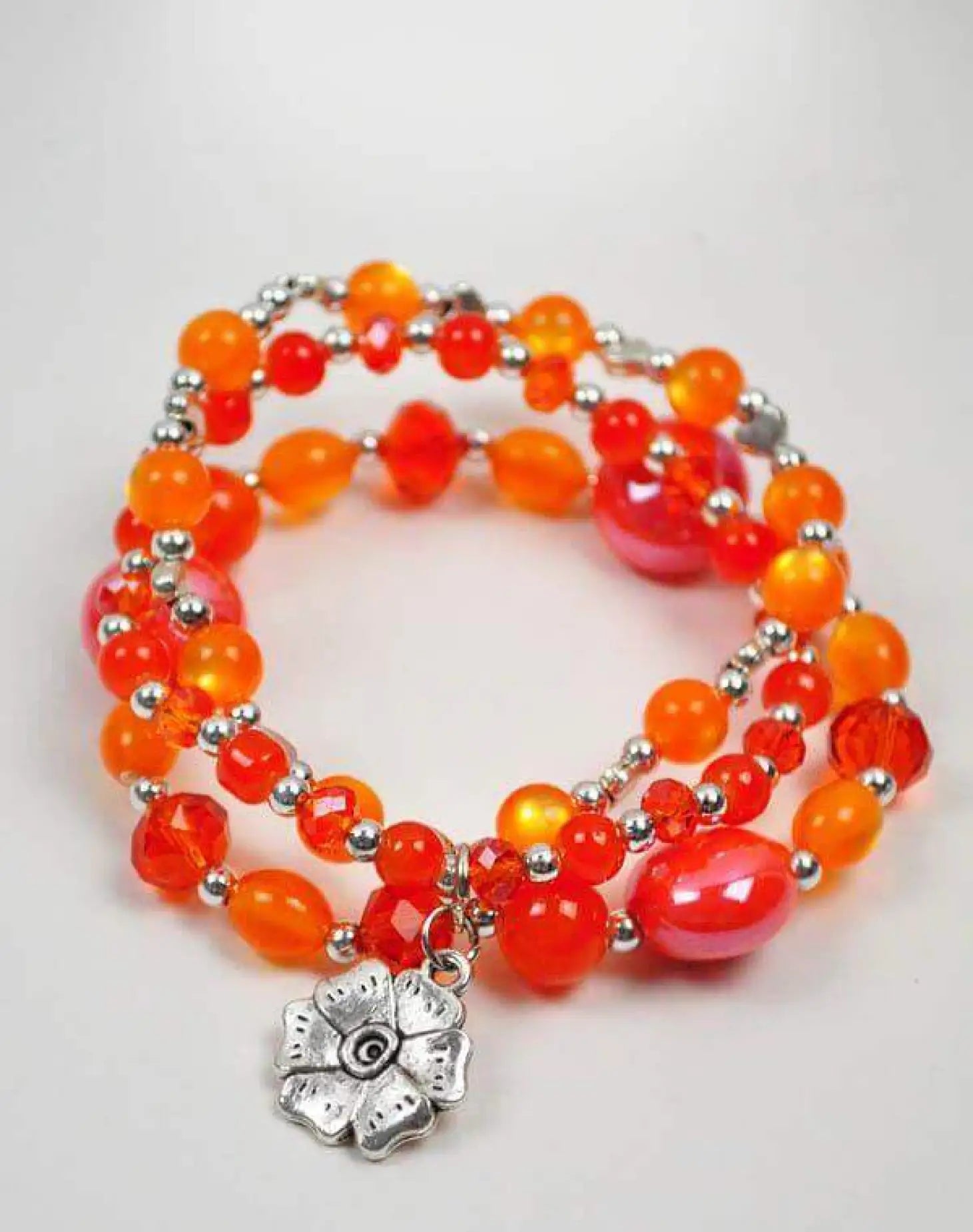 Colourful bead bracelet with silver flower charm from Quad-Set Collection