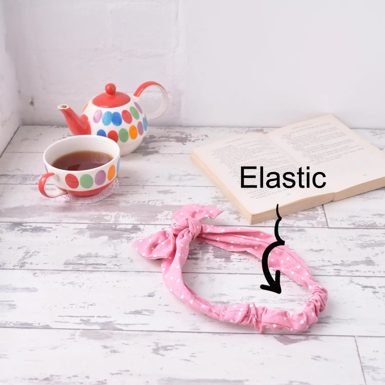 Pink polka hair tie with book and tea beside Retro Heart Print Denim Elastic Headband with Bow.