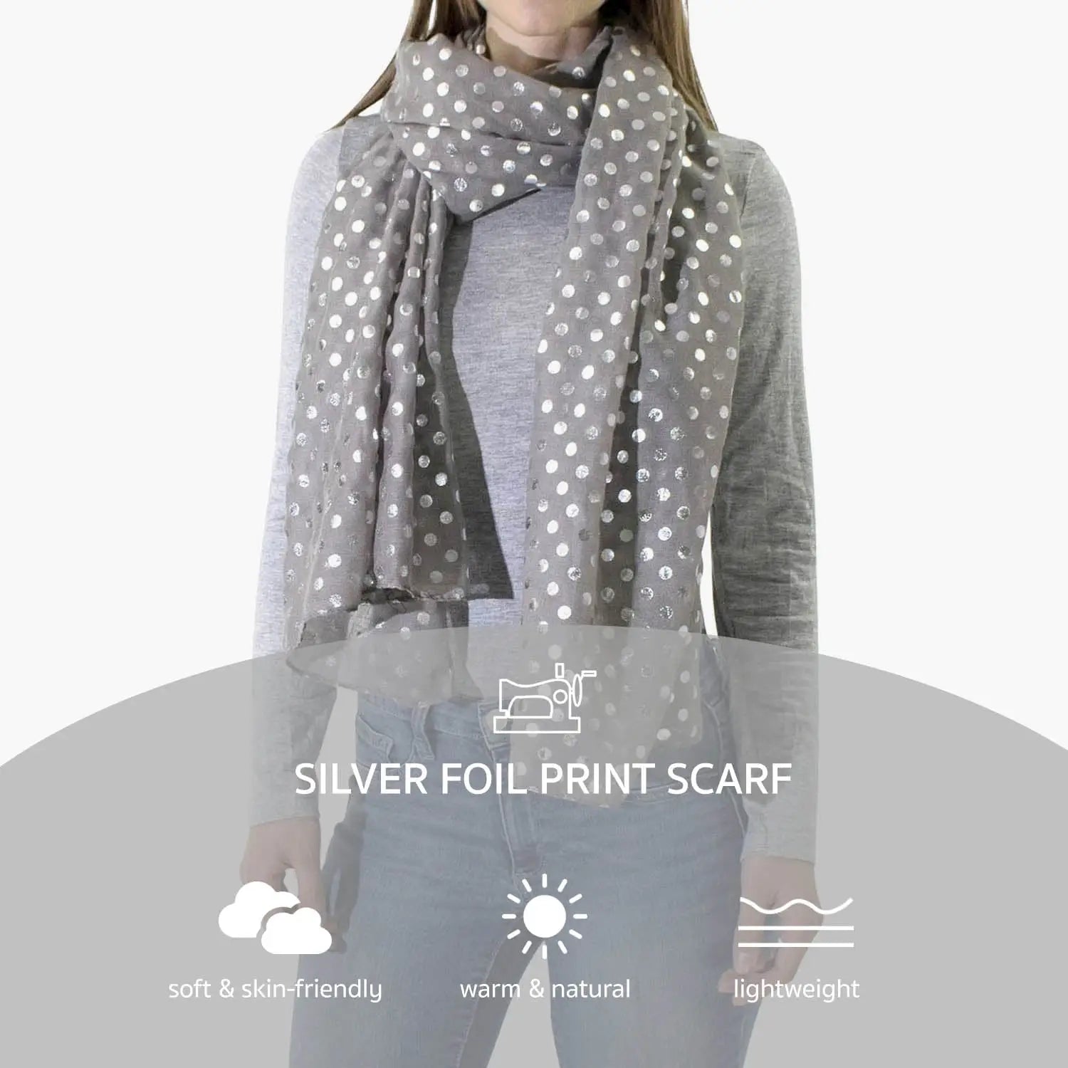 A woman wearing a gray polka dot silver foil oversized scarf