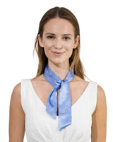 Woman wearing a silky satin skinny blue sash scarf.
