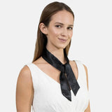 Woman in black and white dress modeling Retro Silky Satin Skinny Ribbon Sash Scarf.
