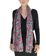 Woman wearing a pink and green ditsy floral print scarf