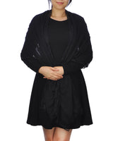 Woman wearing black dress and jacket, showcasing SALE Cotton Crinkled Lace-Edged Evening Scarf in Black.