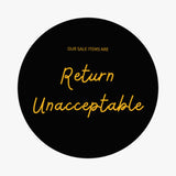 Circular black sign with yellow text stating Our sale items are Return Unacceptable for SALE Leopard Scarf includes damaged fabric