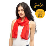 Woman wearing SALE red silk scarf with tag