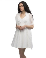 Woman in white dress wearing semi opaque chiffon off white shawl