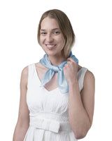 Woman in white dress holding blue bow featured in SALE Plain Mulberry Silk Square Scarf