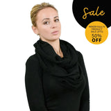 Woman wearing black pleated ribbed snood scarf from SALE collection.