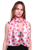 Woman wearing SALE satin lightweight scarf with kiss mark design in pink