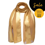 Gold satin stripe scarf with black circle design on black background.