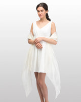 Woman in white dress wearing Sheer Shimmer Evening Lightweight Stole.