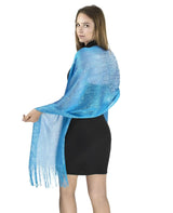 Blue shimmering lurex fishnet scarf worn by woman.