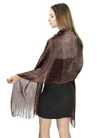 Woman wearing a brown fringed jacket with shimmering lurex fishnet scarf
