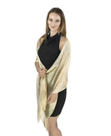 Shimmering lurex fishnet evening shawl worn by a woman