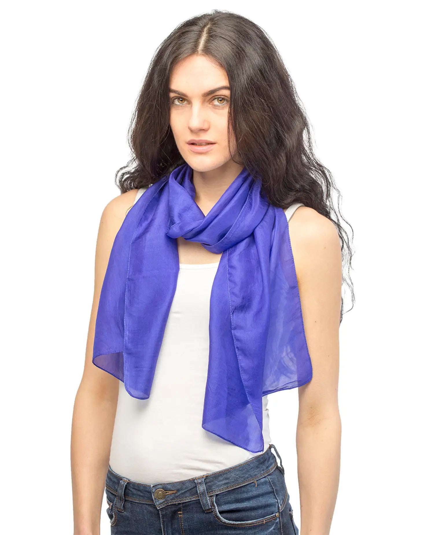 A woman wearing a pure silk lightweight blue scarf