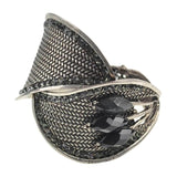 Silver bangle bracelet with black stone centerpiece