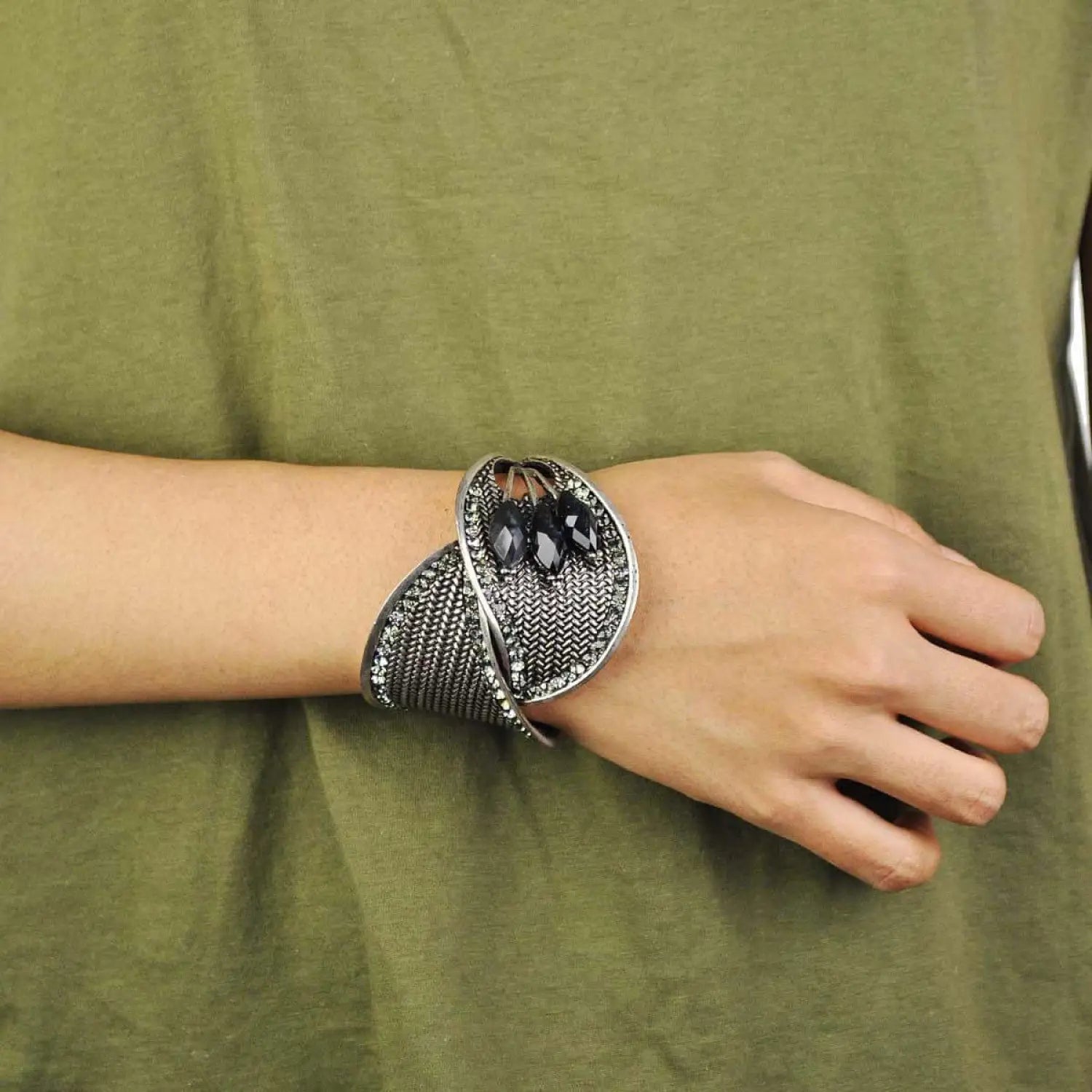 Silver bangle bracelet with black and white snake.