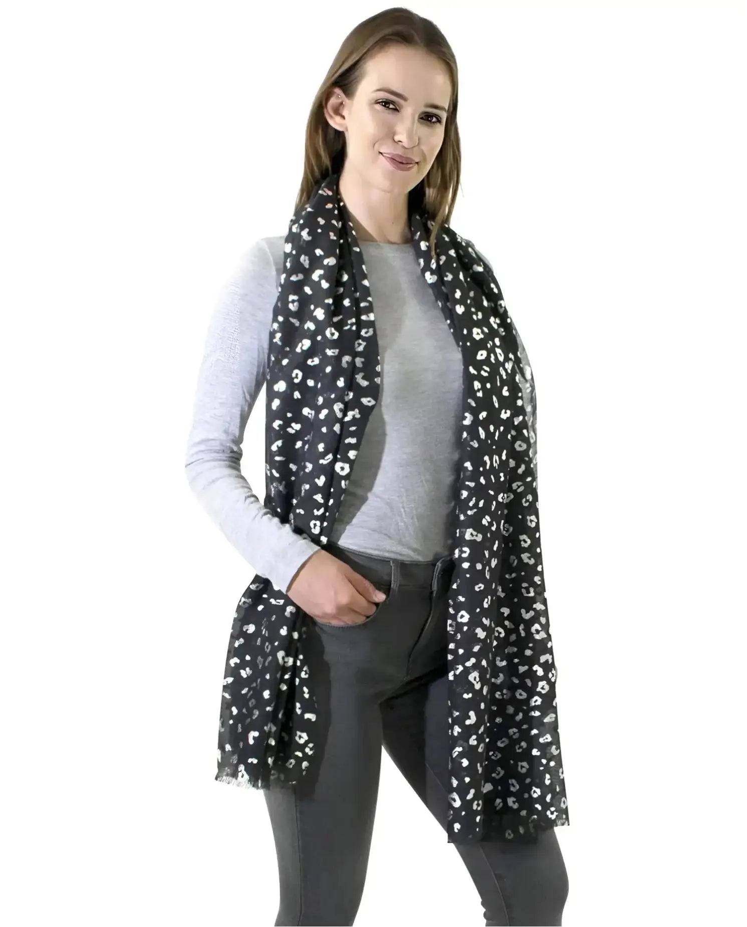 Woman wearing a silver foil leopard print large scarf.