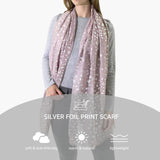 Woman in silver foil leopard print scarf with stars