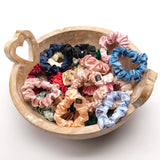 Three pack of small skinny Mulberry silk scrunchies in a bowl