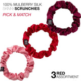Three mulberry silk skinny hair scrunchies in shades of pink and red