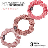 Two pink mulberry silk skinny hair scrunchies on a white background