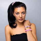 Woman with pink flower wearing Small Skinny Mulberry Silk Hair Scrunchies - 3 Pack