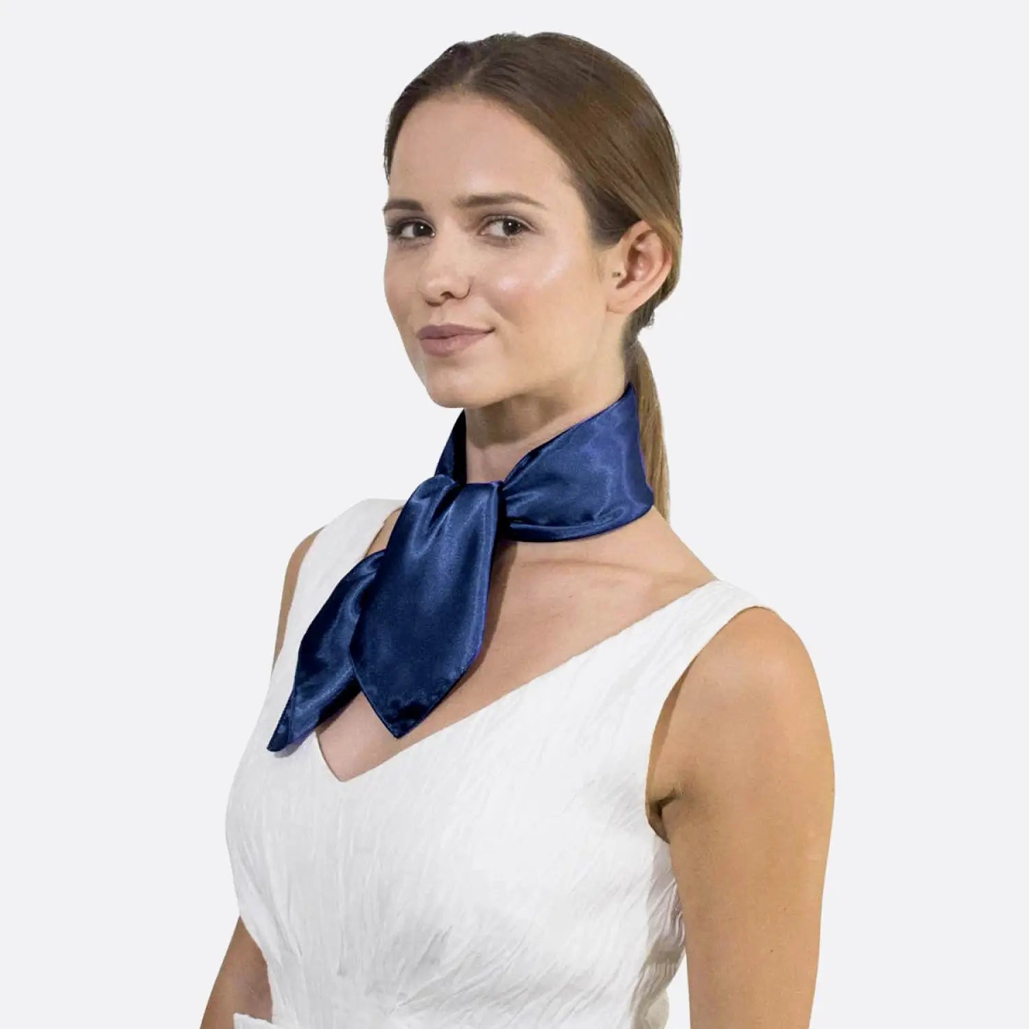 Woman wearing white dress and blue bow, showcasing Smooth Satin Small Square Scarf.