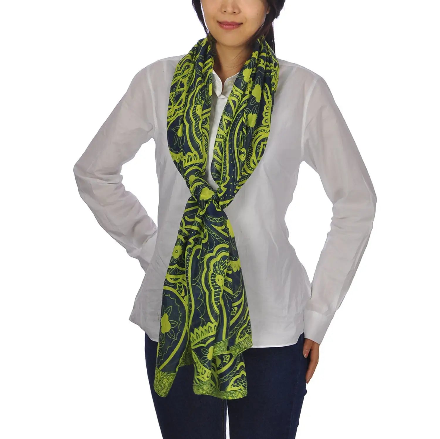 Woman wearing green and black Aztec print oversized pashmina scarf.