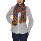 Woman wearing blue and orange Aztec print oversized pashmina scarf