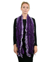 Soft knitted scarf with ruffled texture and striped print on woman