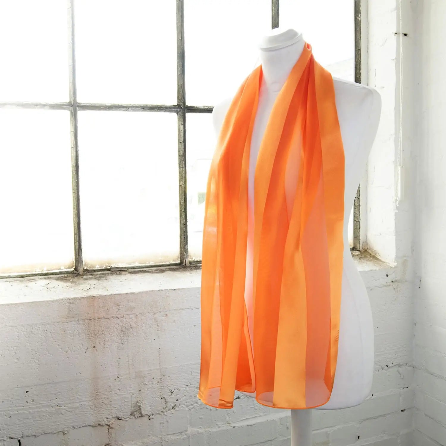 Solid Shimmering Satin Stripe Scarf - Lightweight in bright orange color on mannequin