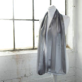 Gray satin stripe scarf draped on mannequin - Solid Shimmering Satin Stripe Scarf.