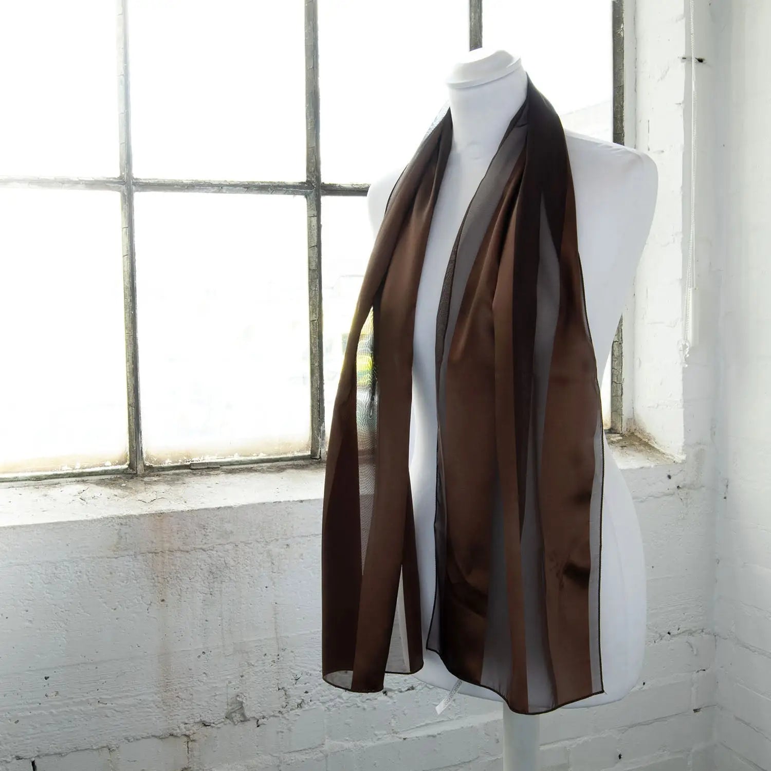 Brown satin stripe scarf displayed on mannequin