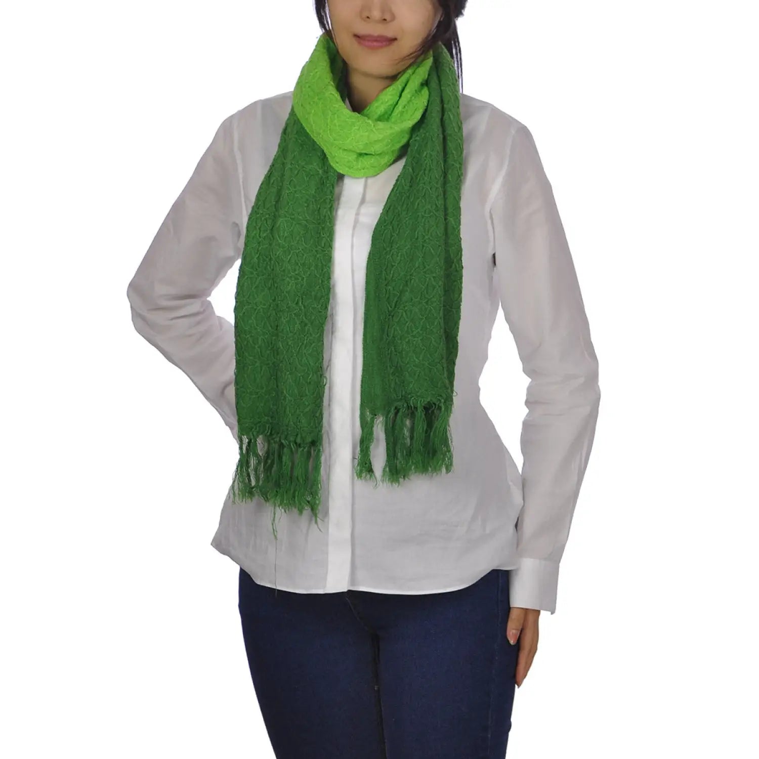 Woman wearing a green embroidered dip dye scarf.