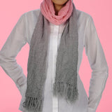 Sophisticated embroidered dip dye scarf worn by a woman