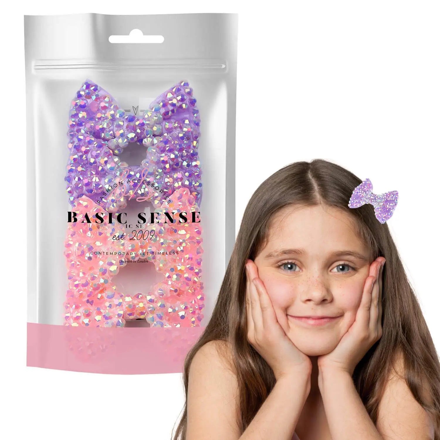 Girl holding face with sparkling bow rhinestone hair clips and glitter bag