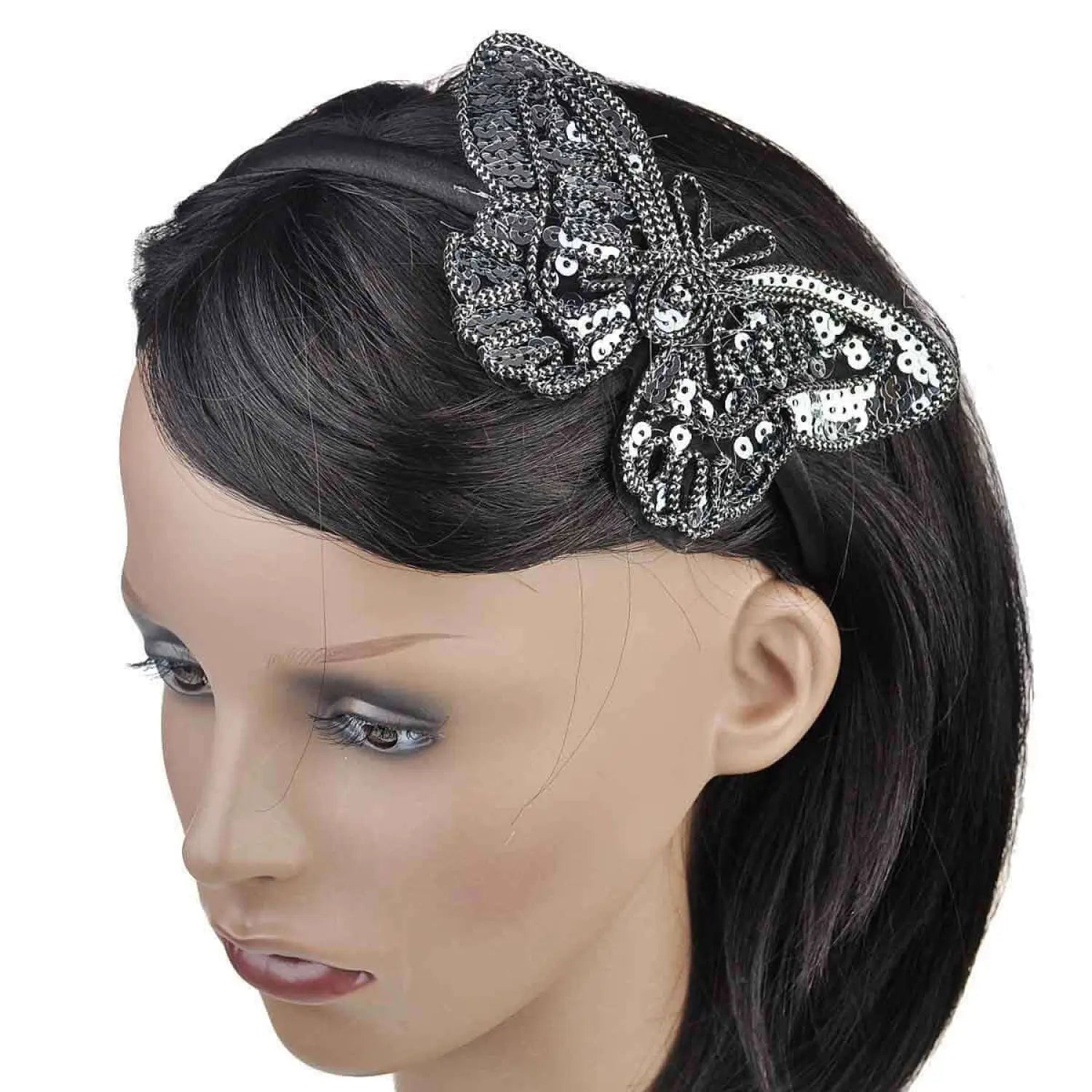 Woman wearing black and white butterfly Alice headband with sequins and spangles.