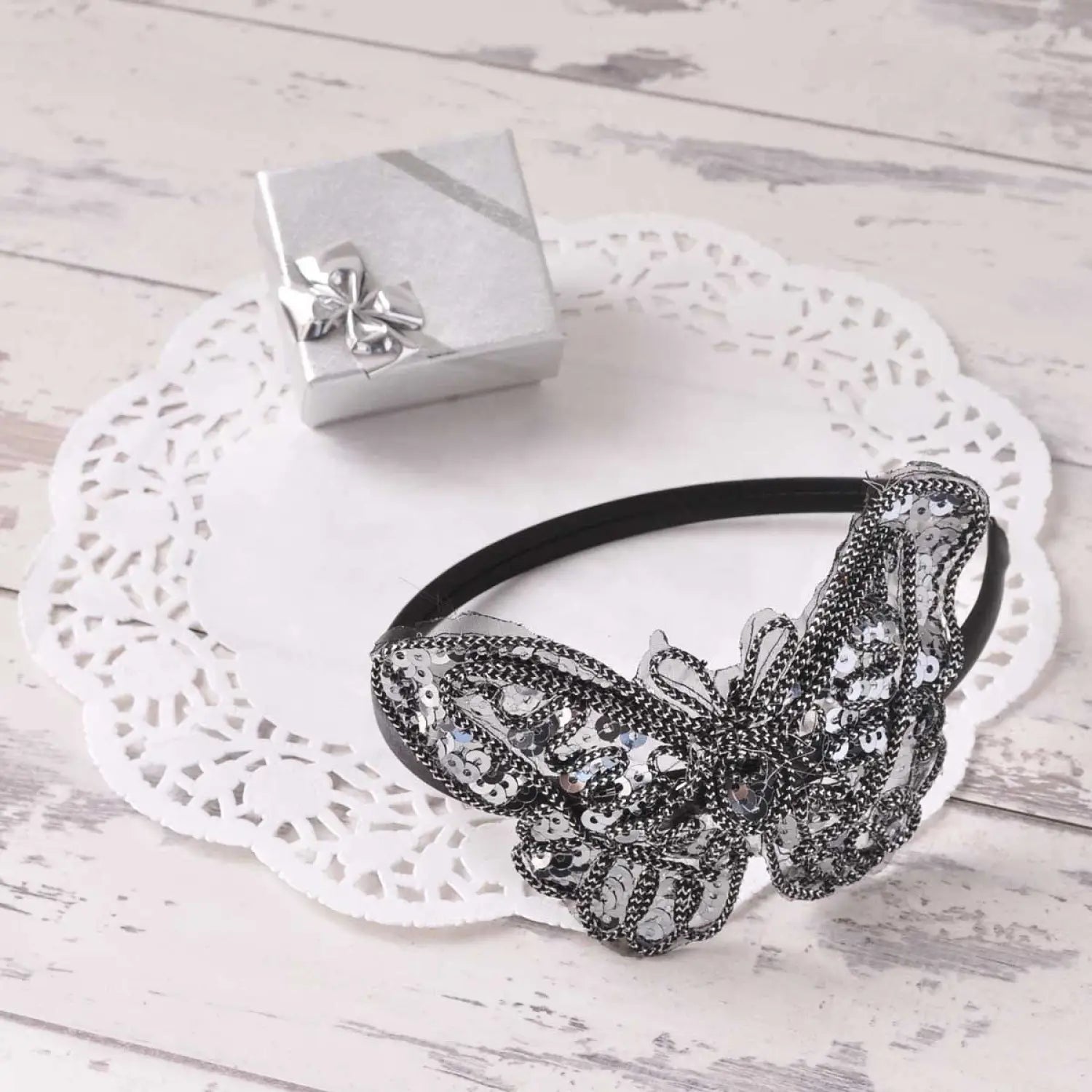 Black headband with silver and white beads on Sparkling Butterfly Alice Headband.