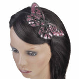 Woman wearing pink and black butterfly hair clip on Sparkling Butterfly Alice Headband.