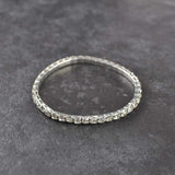 Close up of sparkling stone cuff diamond ring on table