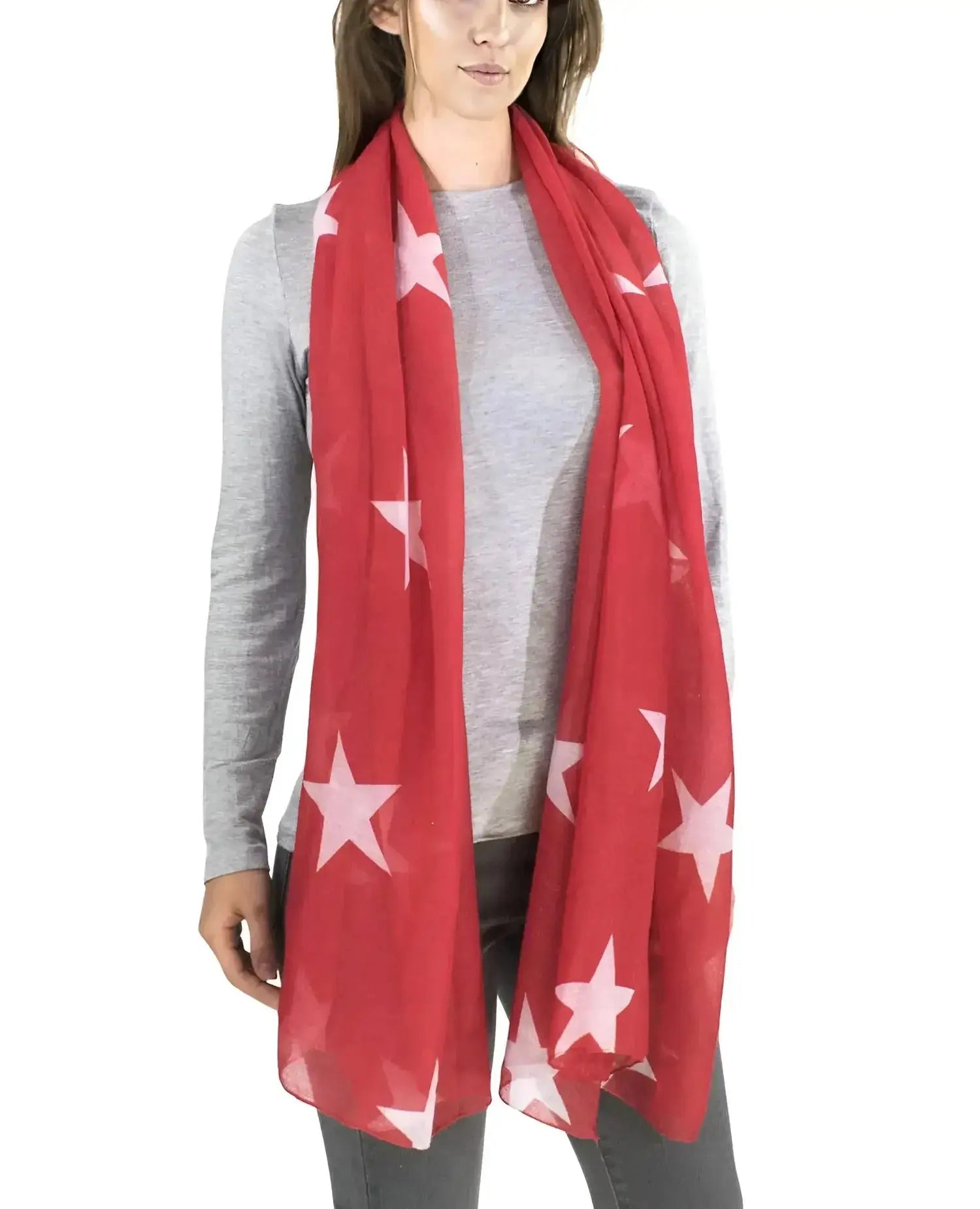 Woman wearing retro star oversized scarf with white stars.